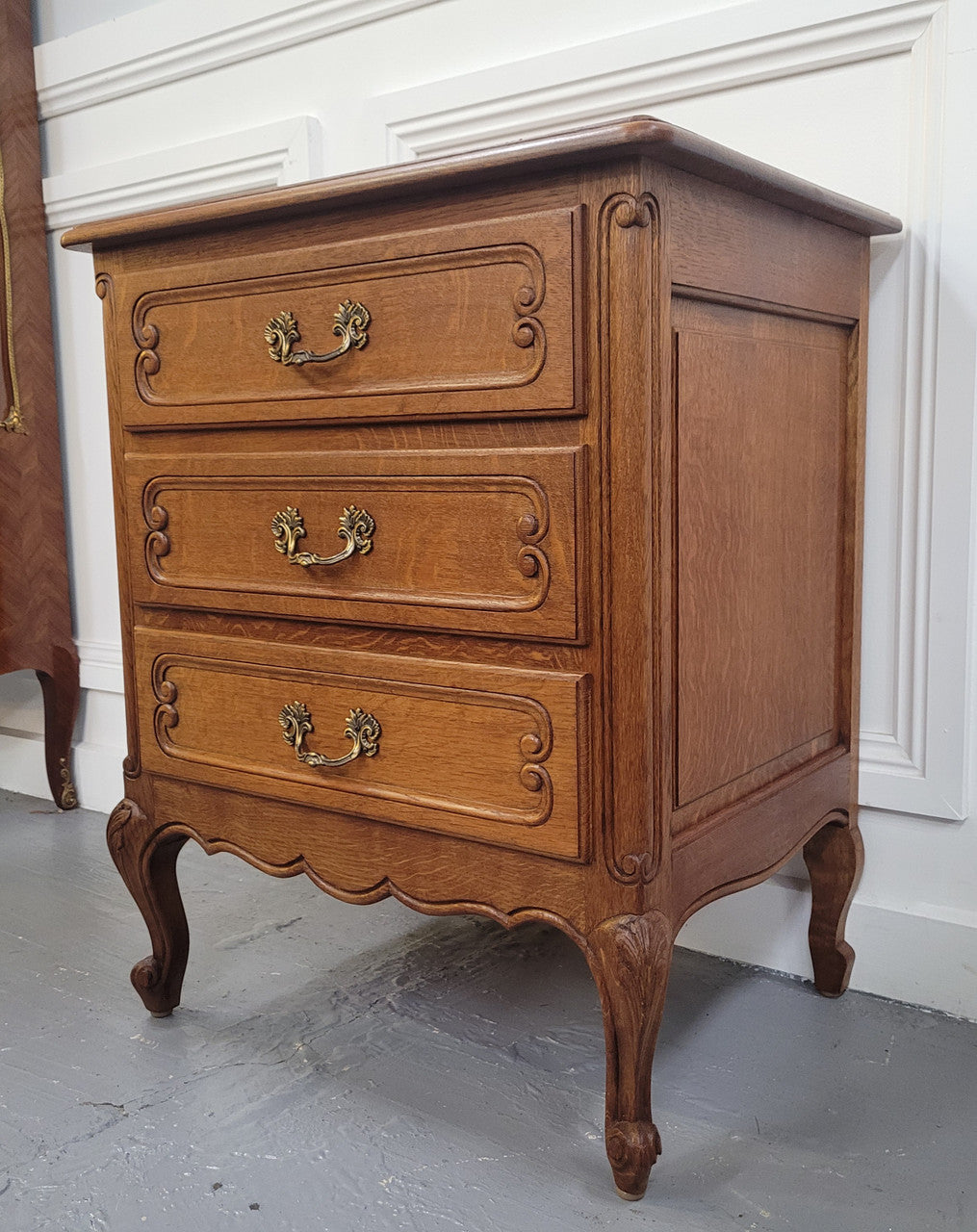 French Oak Louis XV style side drawers with lovely handles and three drawers. It has been sourced from France and is in good original detailed condition.