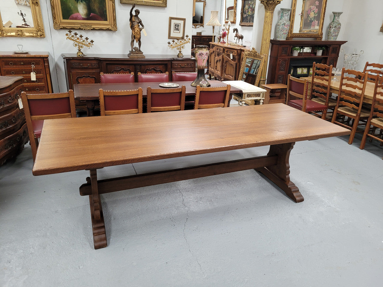 Sensational long French Oak farmhouse table of large proportions on a stretcher base. It has been fully restored with a hard oil water resistant finish. This fabulous table would seat 10 to 12 people.