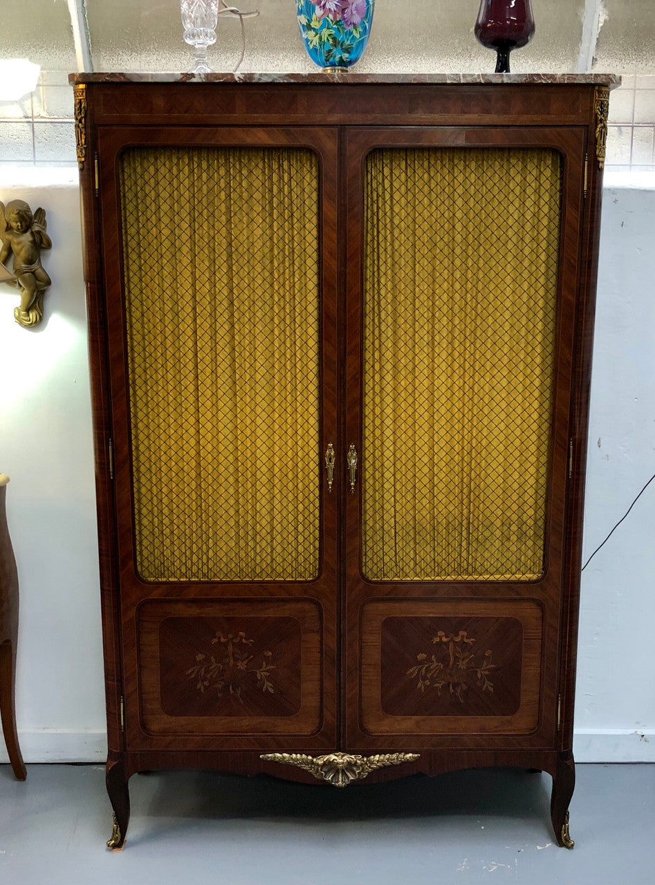 Beautiful 19th Century French Louis XV style Mahogany Blind Bookcase. This piece has lovely inlaid doors and ormolu mounts, marble top and four adjustable shelves. In good original detailed condition.