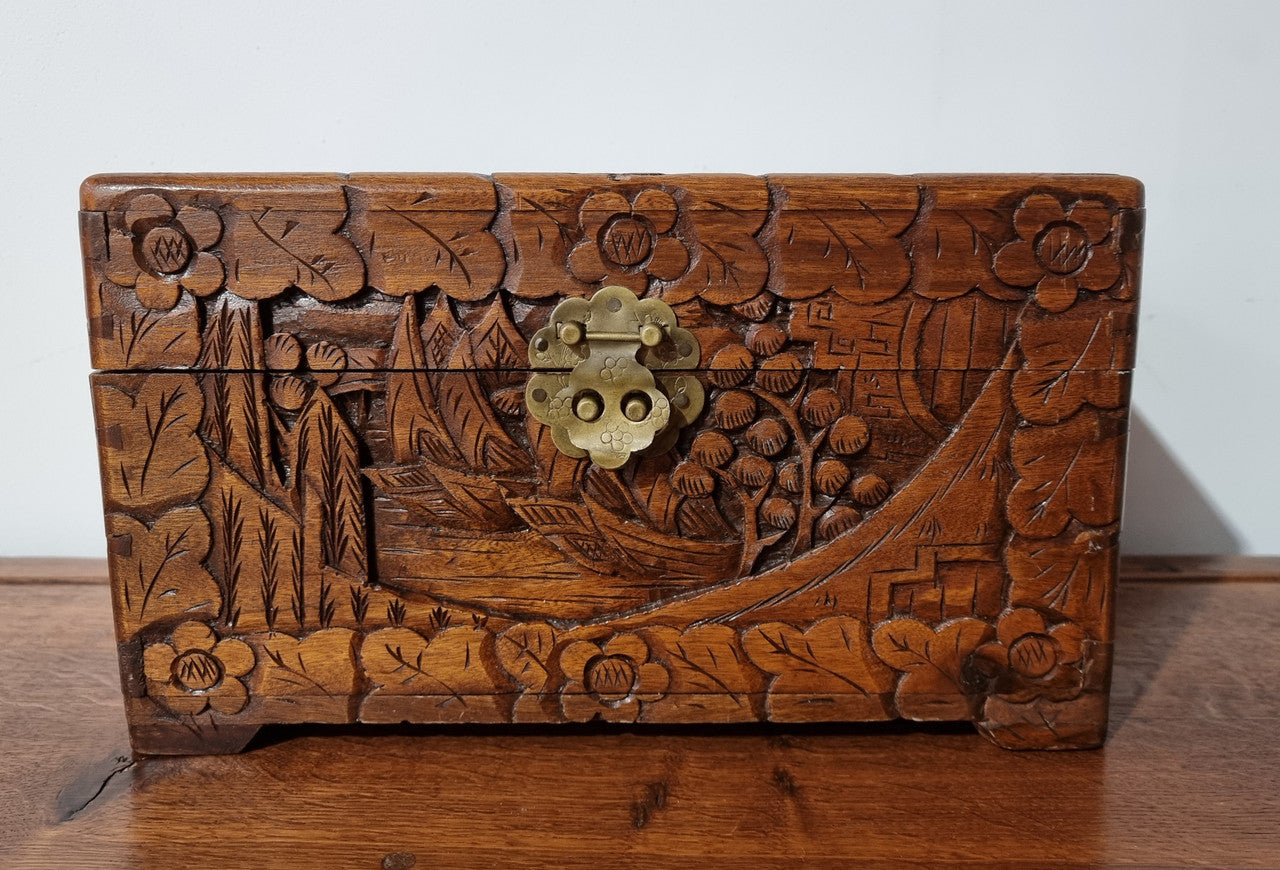 Small Chinese carved camphor wood jewellery box. It is in original condition.