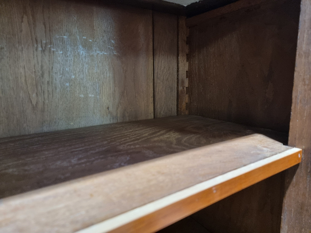 Antique Mahogany two door Biedermeier style bookcase with four fully adjustable shelves and a drawer at the bottom. The two wooden finials at the top are easily removed for a different look of desired. In good original detailed condition.