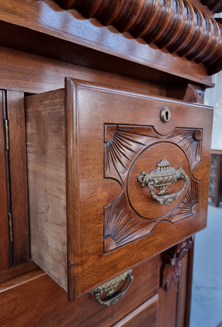 A 19th Century Scottish Mahogany tall boy/ chest of six drawers with small cabinet section at the top. Beautiful carvings and easily comes apart into three sections making transport for moving into place easy. In good original detailed condition.