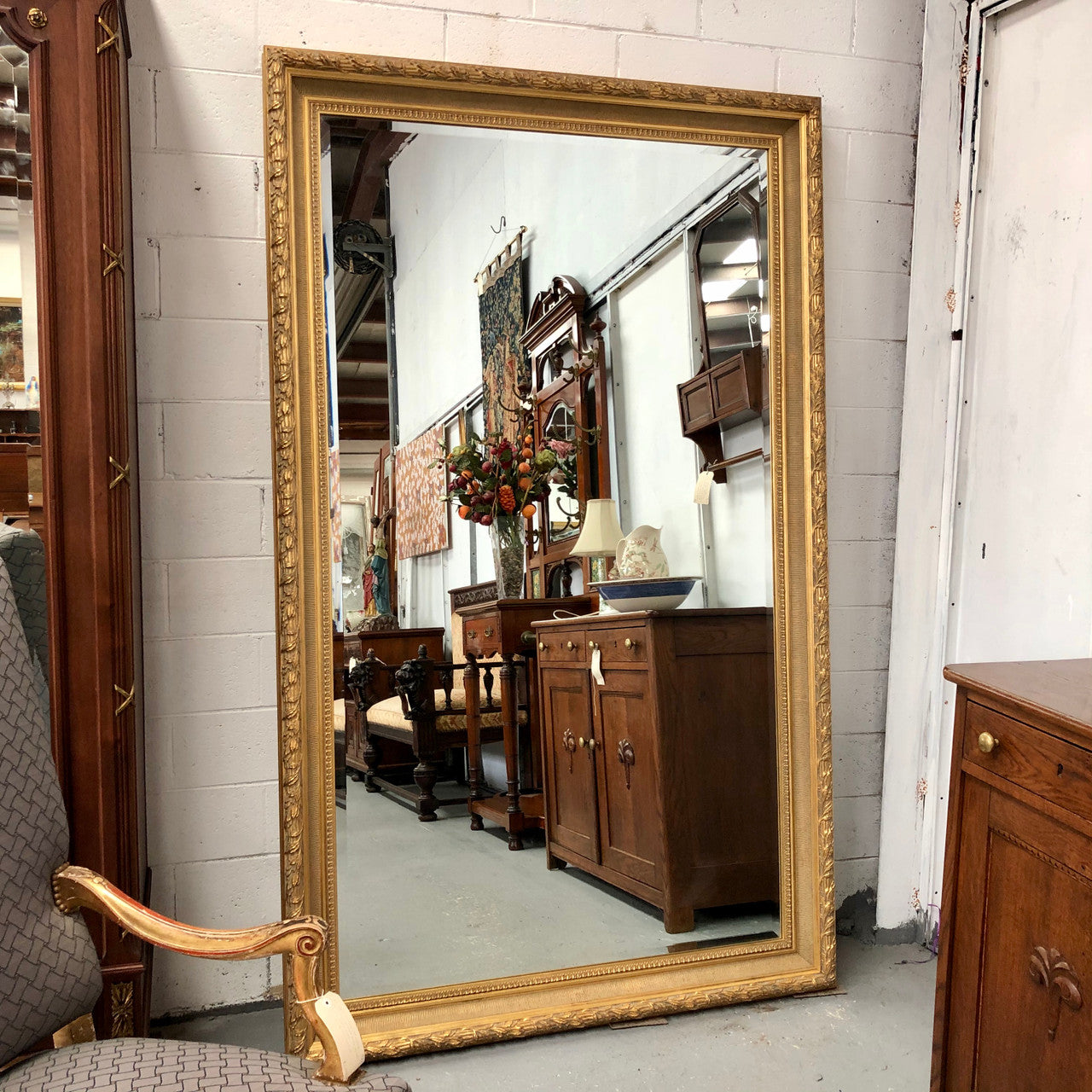 Very large French style mirror with beveled glass. In very good original condition.