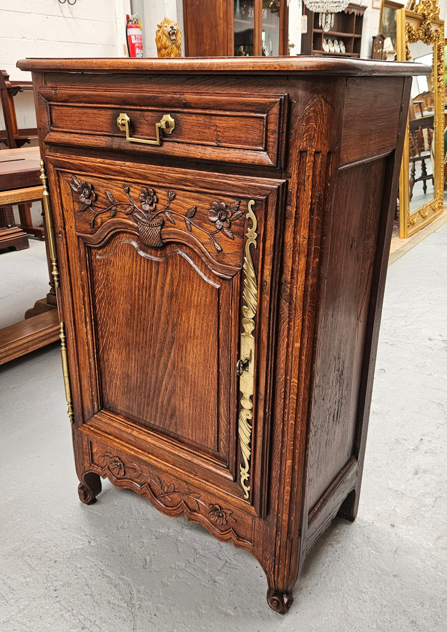 Louis 15th style oak 19th century cabinet with lovely brass hinges, handles & charming carving. Circ: 1860's. In good original condition.