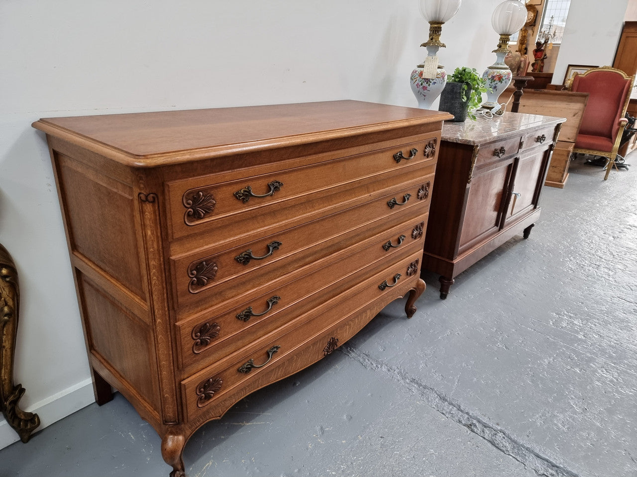 Fabulous French light Oak of chest of four drawers with lovely decorative carving. In good original detailed condition.