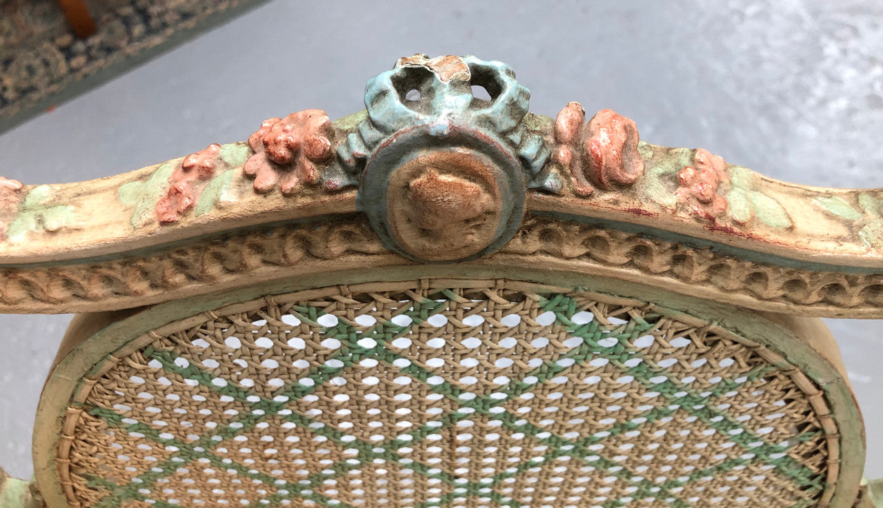 Painted French Louis XVI style cane panel arm chair. Paint is original and it is in very good original condition.