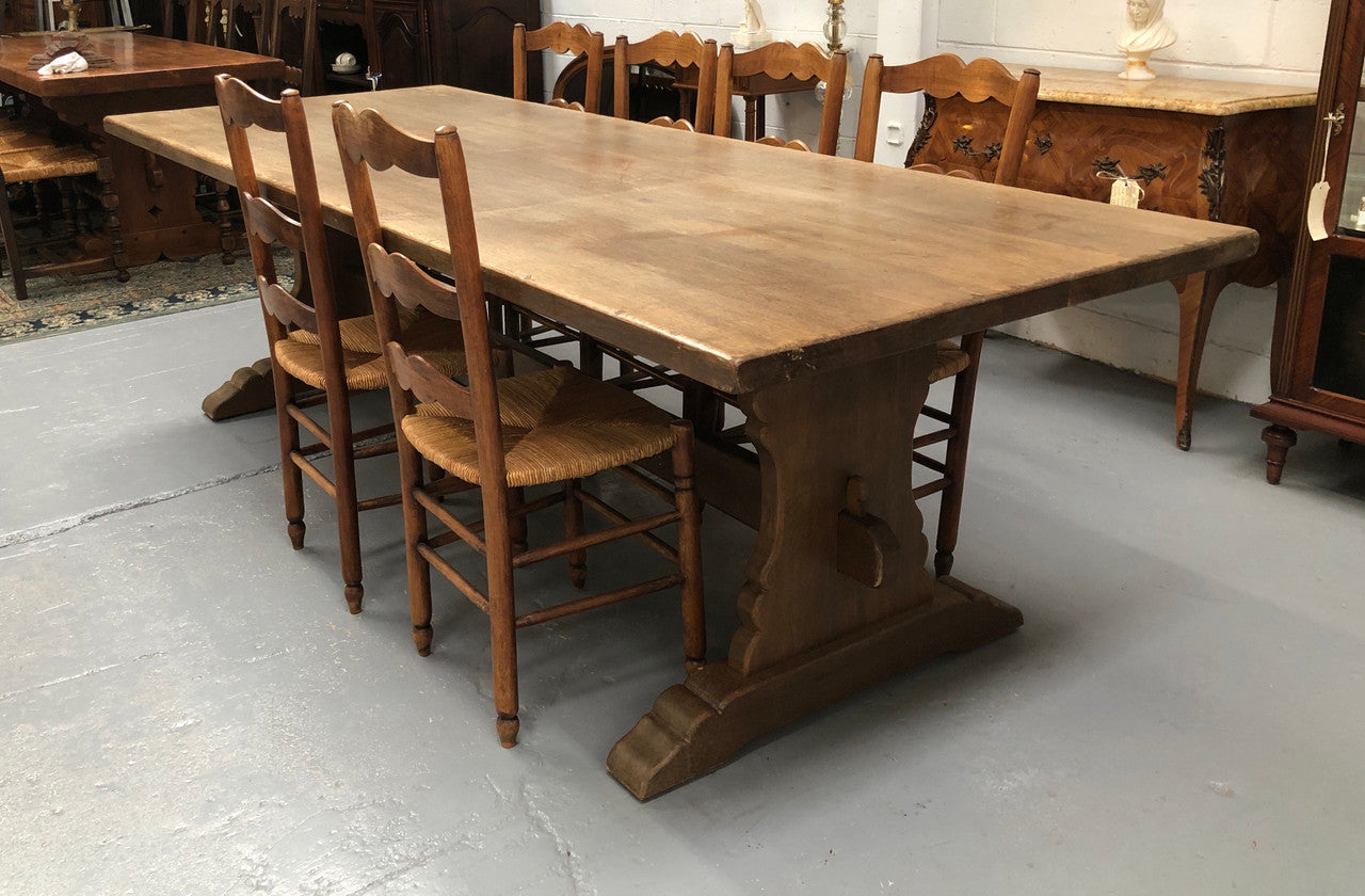 Lovely long French light oak Farmhouse table with a good thick plank top and beautiful stretcher base. Can seat 12 people very comfortable and is in good original condition.