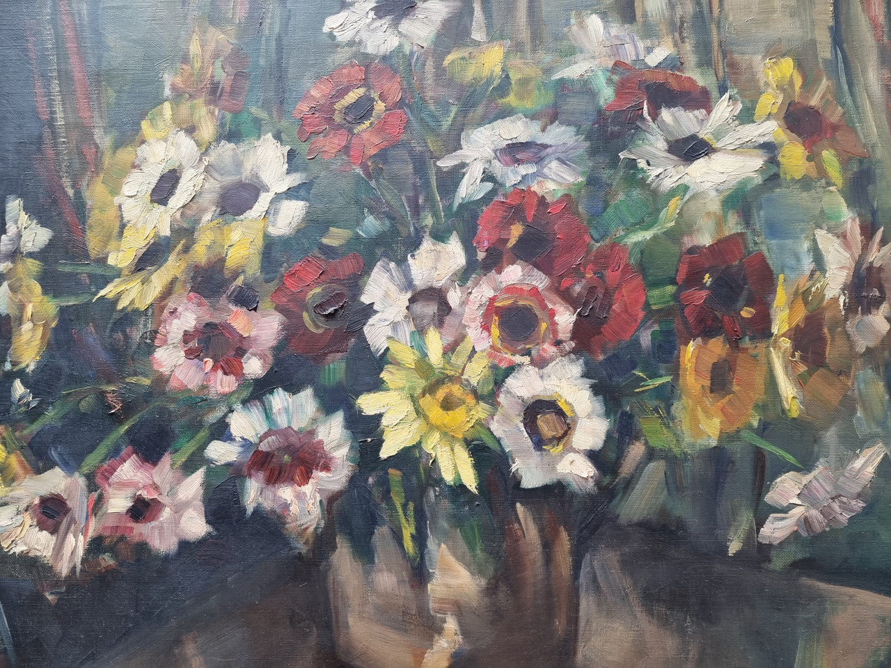 Sourced in France is this beautiful floral oil painting on canvas and framed in a lovely decorative frame. It is in good original condition.