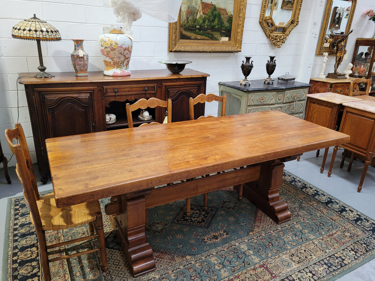 French Farmhouse table with a beautiful thick plank top and stretcher base. Can seat 8-10 people comfortably and is in good original detailed condition.