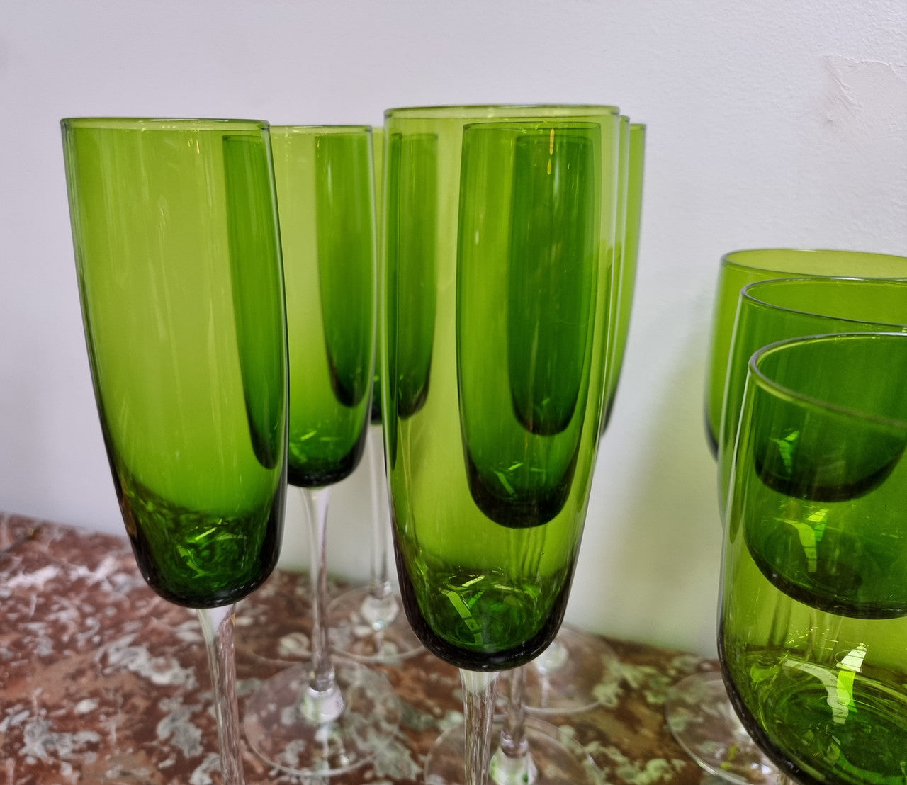 Beautiful set of 12 Vintage emerald green hand made wine glasses. Possibly Italian or French. They are in good original condition with no chips or cracks.