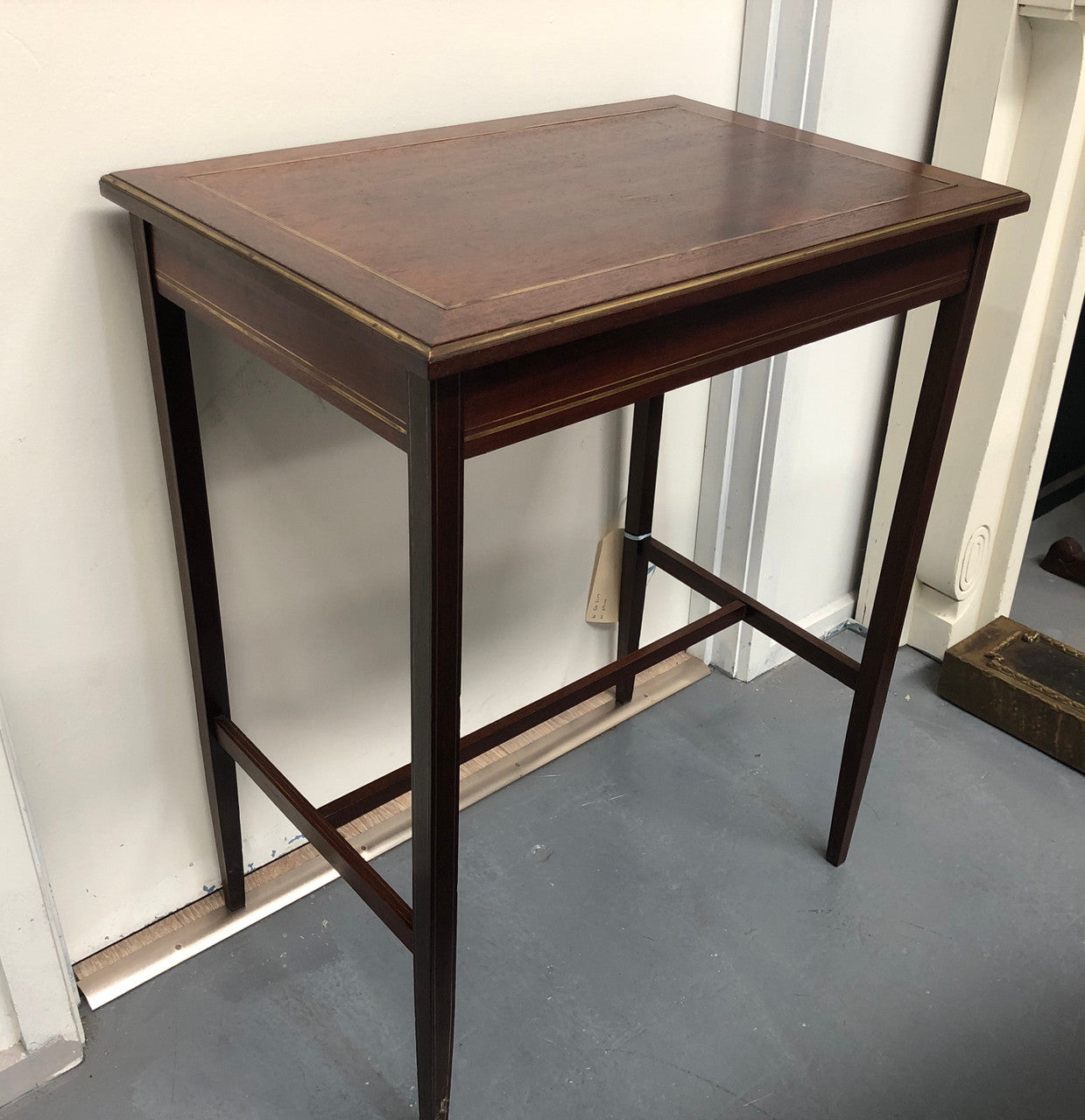 Elegant rectangular mahogany French brass inlaid occasional table. Is in good original condition.