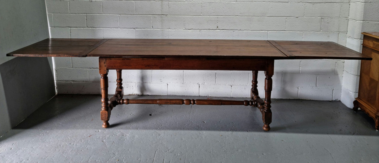 Appealing and rare French Oak Farmhouse extension table. Charming character to the top and comfortably seats 12 people. In good original detailed condition.
