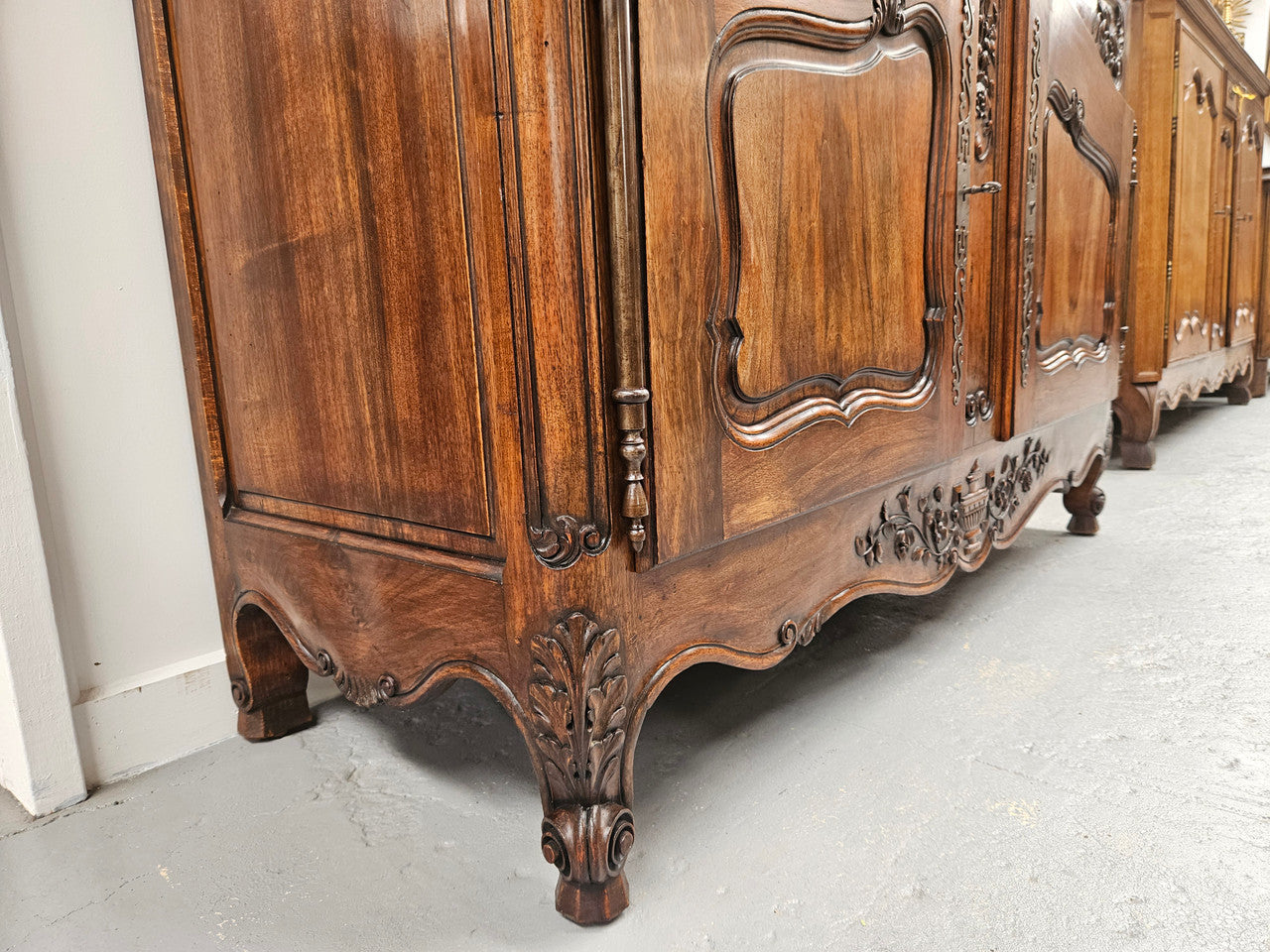 Attractive French Walnut Louis XV style two door two drawer sideboard featuring beautiful carving. Circa: 1930's. It has been sourced from France and it is in good original detailed condition.
