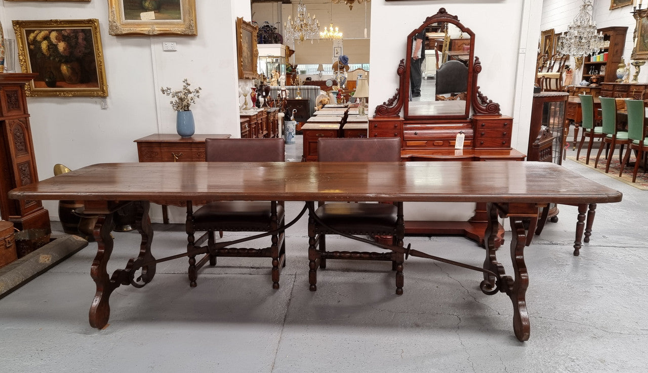 Amazing hard to find French Fruitwood Spanish style 3 meter dining table. Decorative iron work underneath and in good detailed original condition.