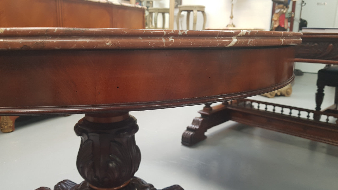 A superb early 19th century French Louis Philippe mahogany centre table, with original round carved rough marble with reeded-edge and is in good original condition.