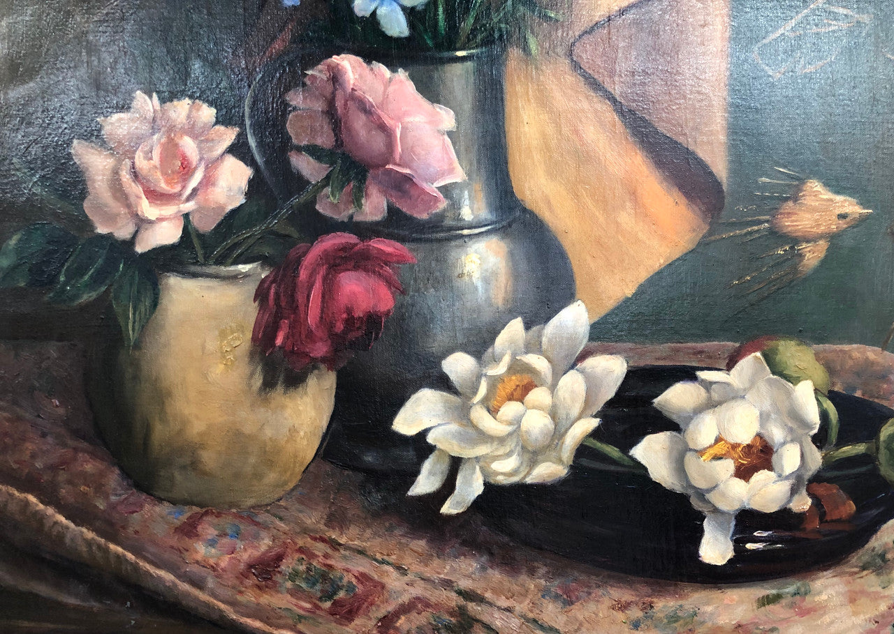 An Antique gilt-framed oil painting of floral still life. Housed in a double sweep gilt frame, signed and dated in good condition.