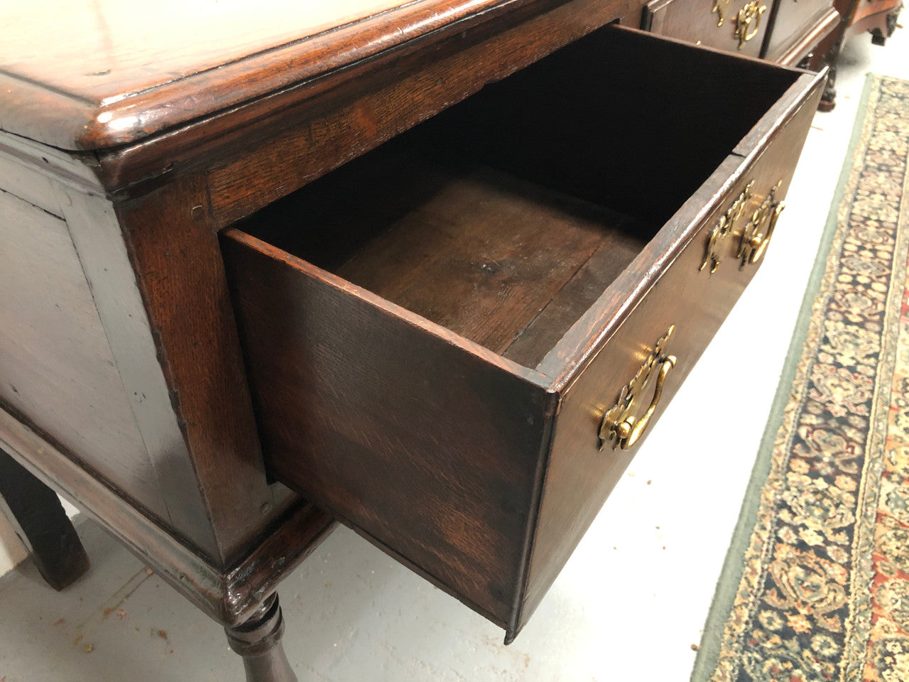 Early 19th Century English Oak dresser base with three large drawers. In very good original detailed condition.