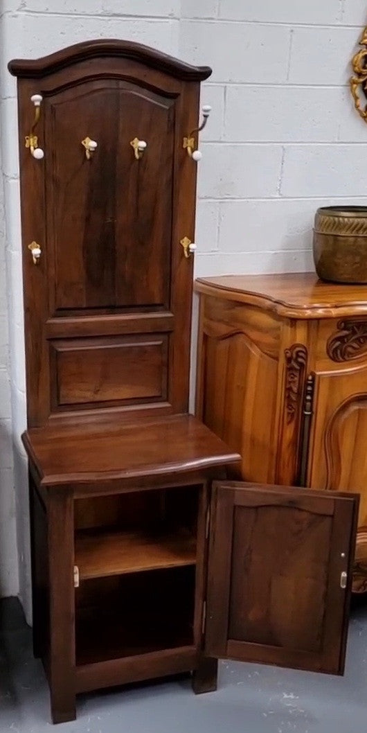 Lovely entrance piece with shelf and single door cupboard, topped with a section for hanging jackets, hats etc. Sourced from France and in good original detailed condition.