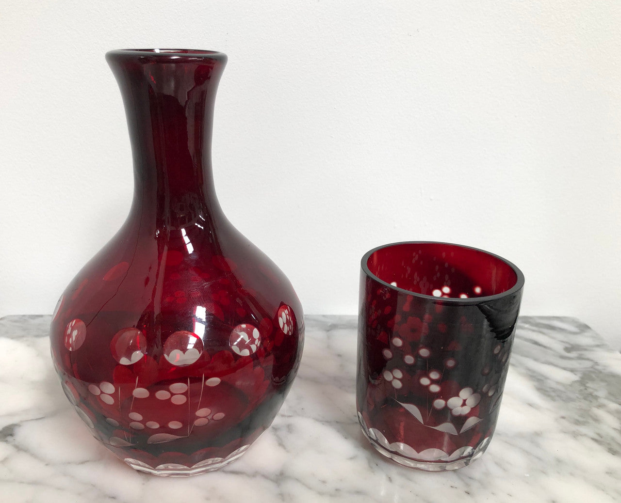 Vintage flash ruby glass water carafe with matching drinking glass.