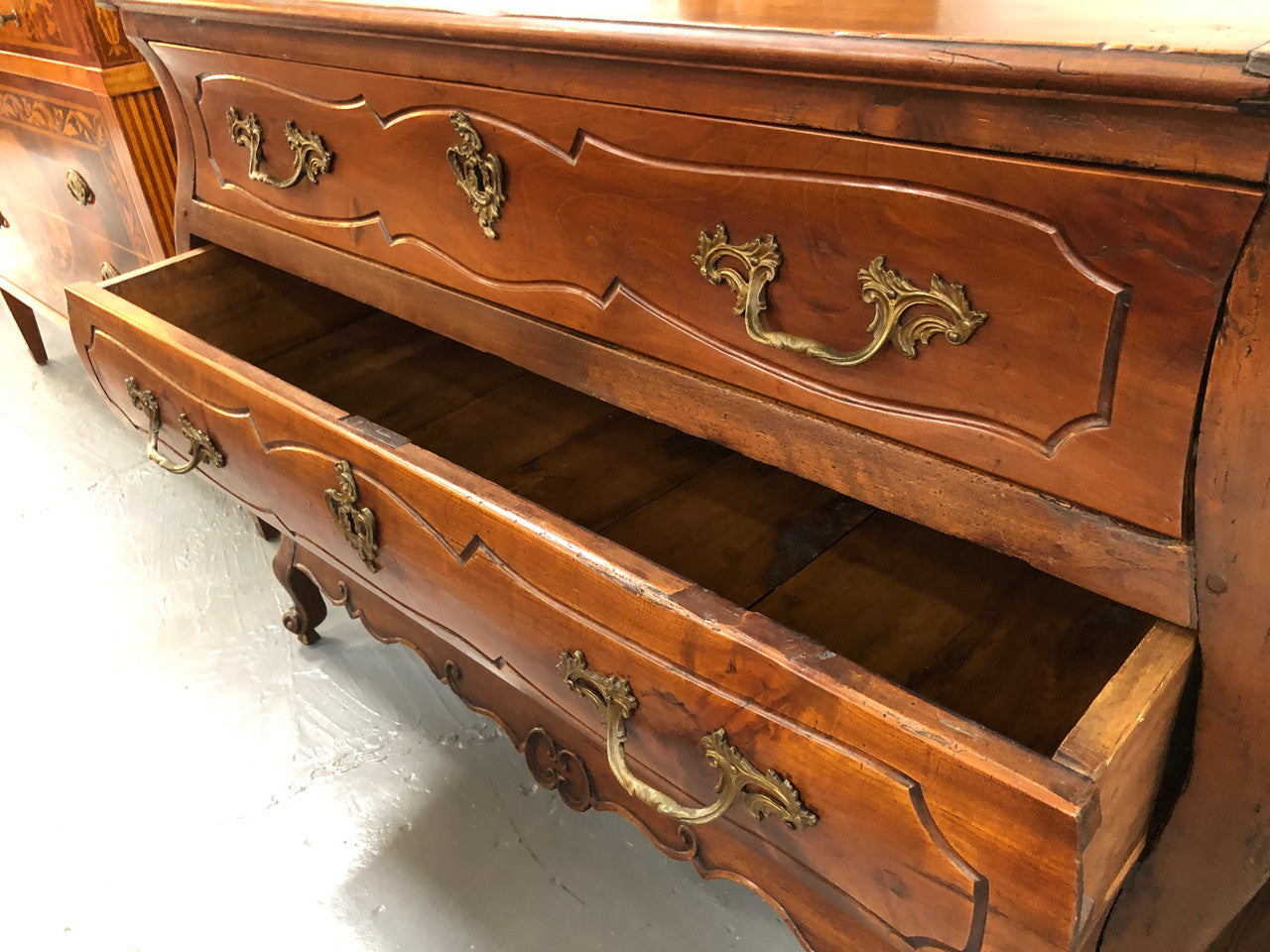Beautiful 18th Century French all Cherrywood three drawer commode with beautiful ormolu mounts and handles. It is in good original detailed condition.