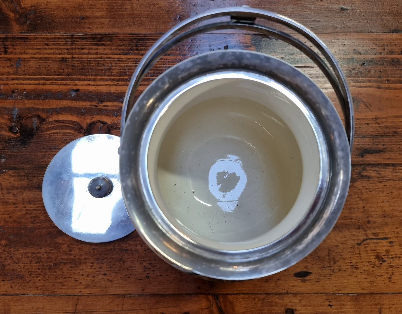 Royal Doulton Biscuit Barrel with silver plated top, handle and lid. Displaying a Daffodil pattern. In original condition please view photo's as they form part of the description.