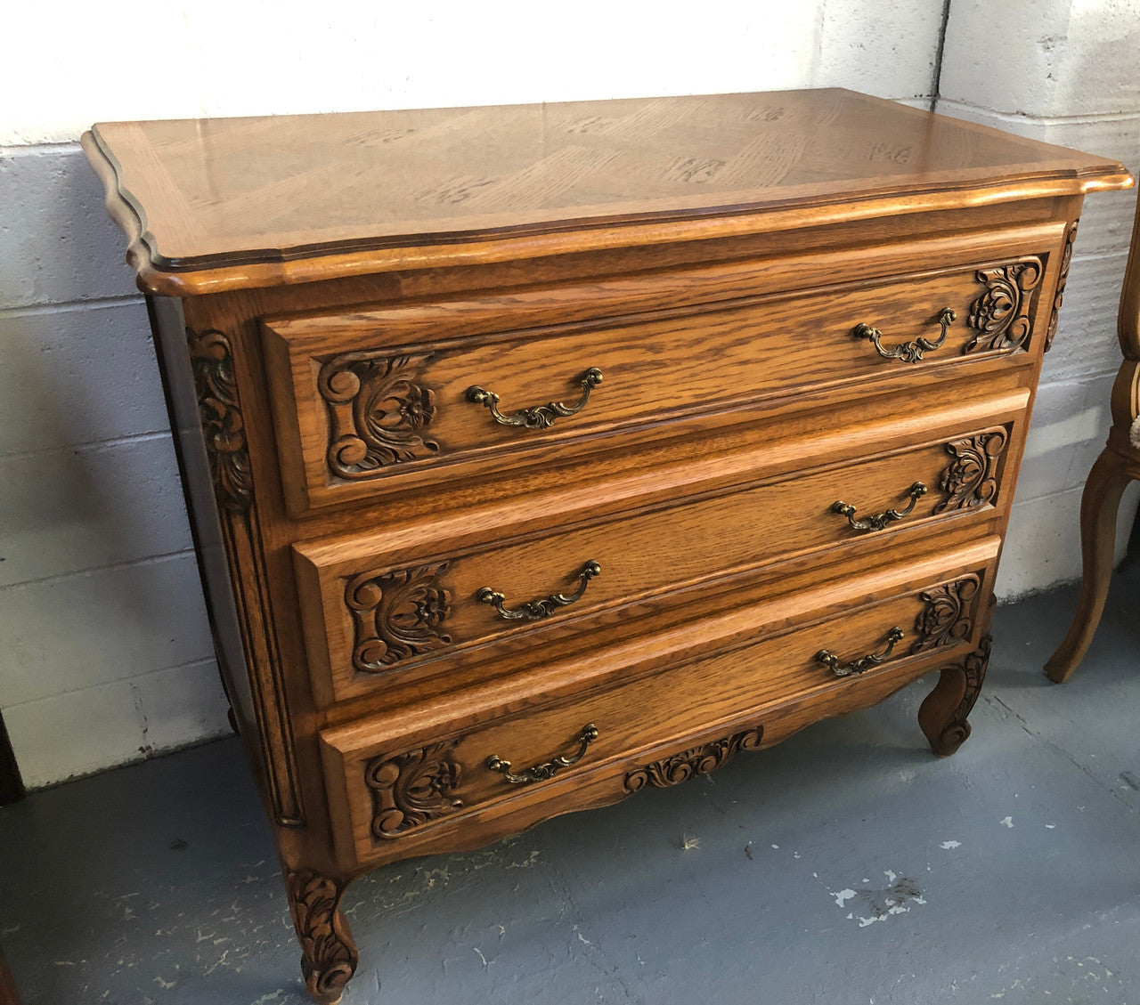 Gorgeous Provincial oak and parquetry top commode. It has beautiful carved Details and in good original detailed condition.