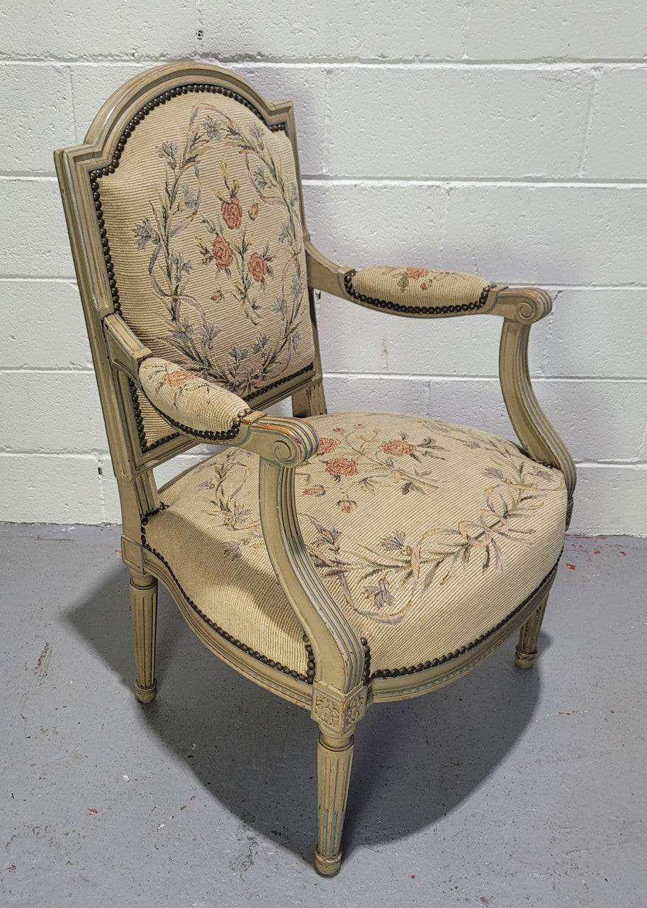 Lovely French Louis XVI style painted and Tapestry upholstered fauteuil. In good original condition, and very comfortable.