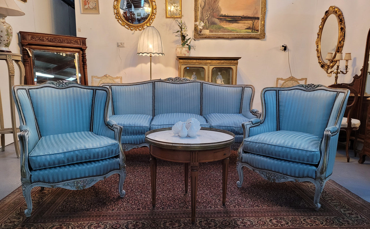 Well Proportioned Louis XV Salon Suite consisting of well proportioned 3 seater down cushioned, winged settee with 2 matching bergere chairs. All upholstered in stunning blue self stripe fabric. In excellent condition. Circa: 1930's.