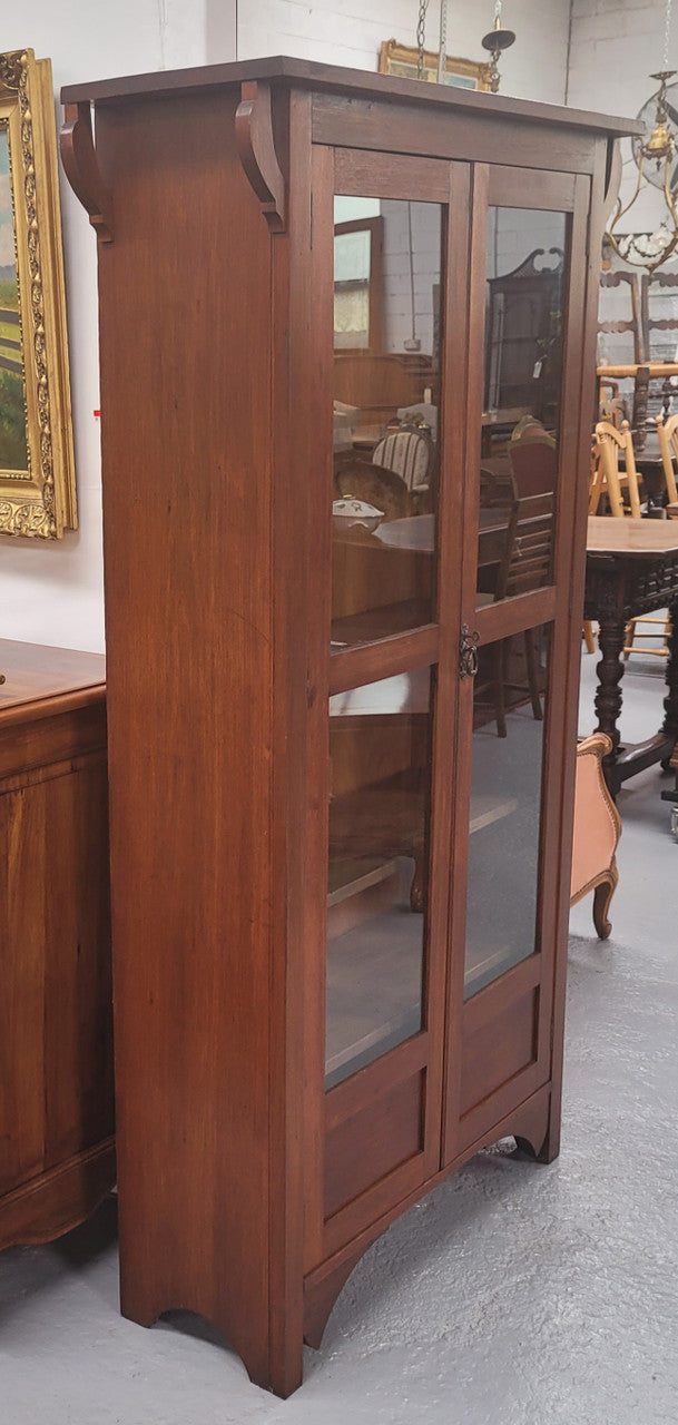 Beautiful two door Blackwood bookcase with glass doors and with four fully adjustable shelves. It is in good original detailed condition.