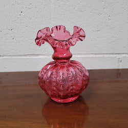 Very attractive Fenton cranberry red glass vase in the melon shape with beading between each segment and and a lovely frilled top. In excellent condition.