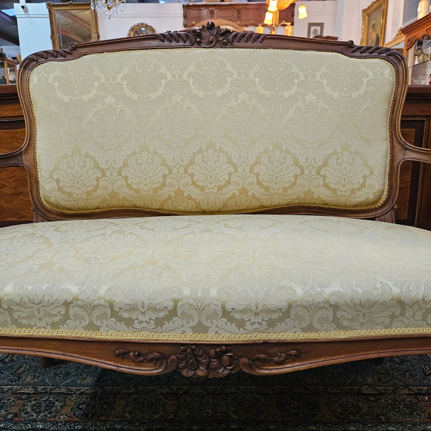 Stunning Louis XV style nicely upholstered walnut settee. Upholstery is in very good original condition, please view photos as they form part of the description. 