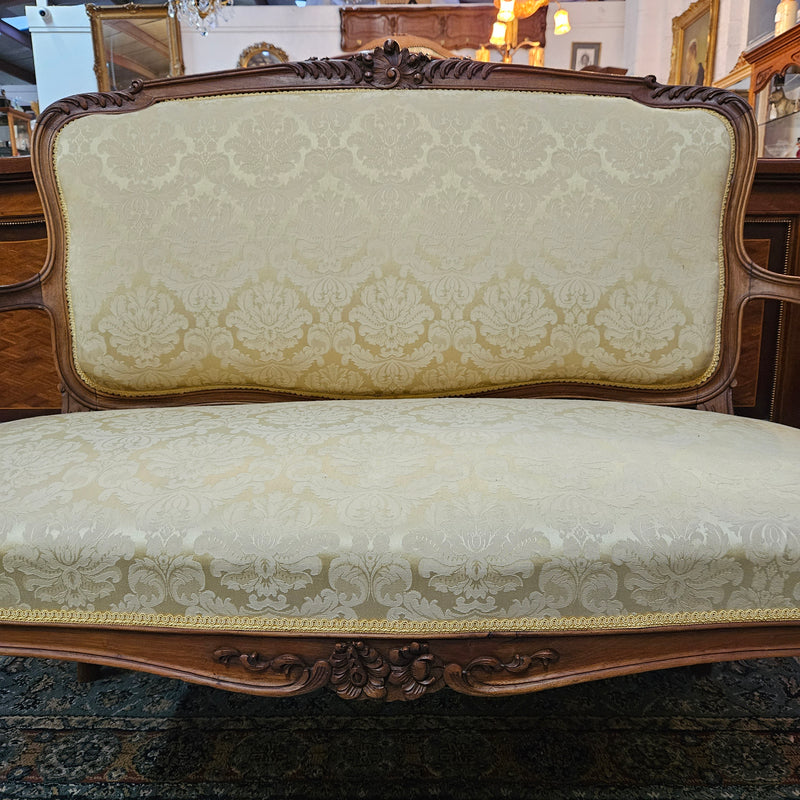 Stunning Louis XV style nicely upholstered walnut settee. Upholstery is in very good original condition, please view photos as they form part of the description. 