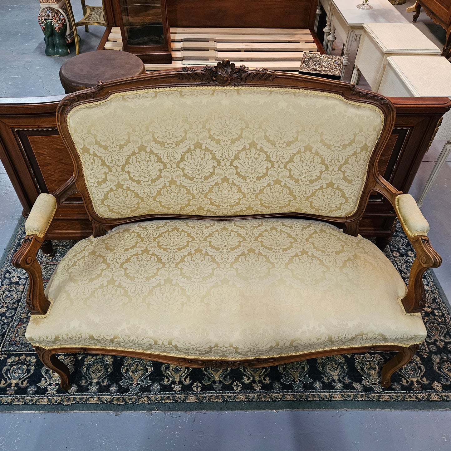 Stunning Louis XV style nicely upholstered walnut settee. Upholstery is in very good original condition, please view photos as they form part of the description. 