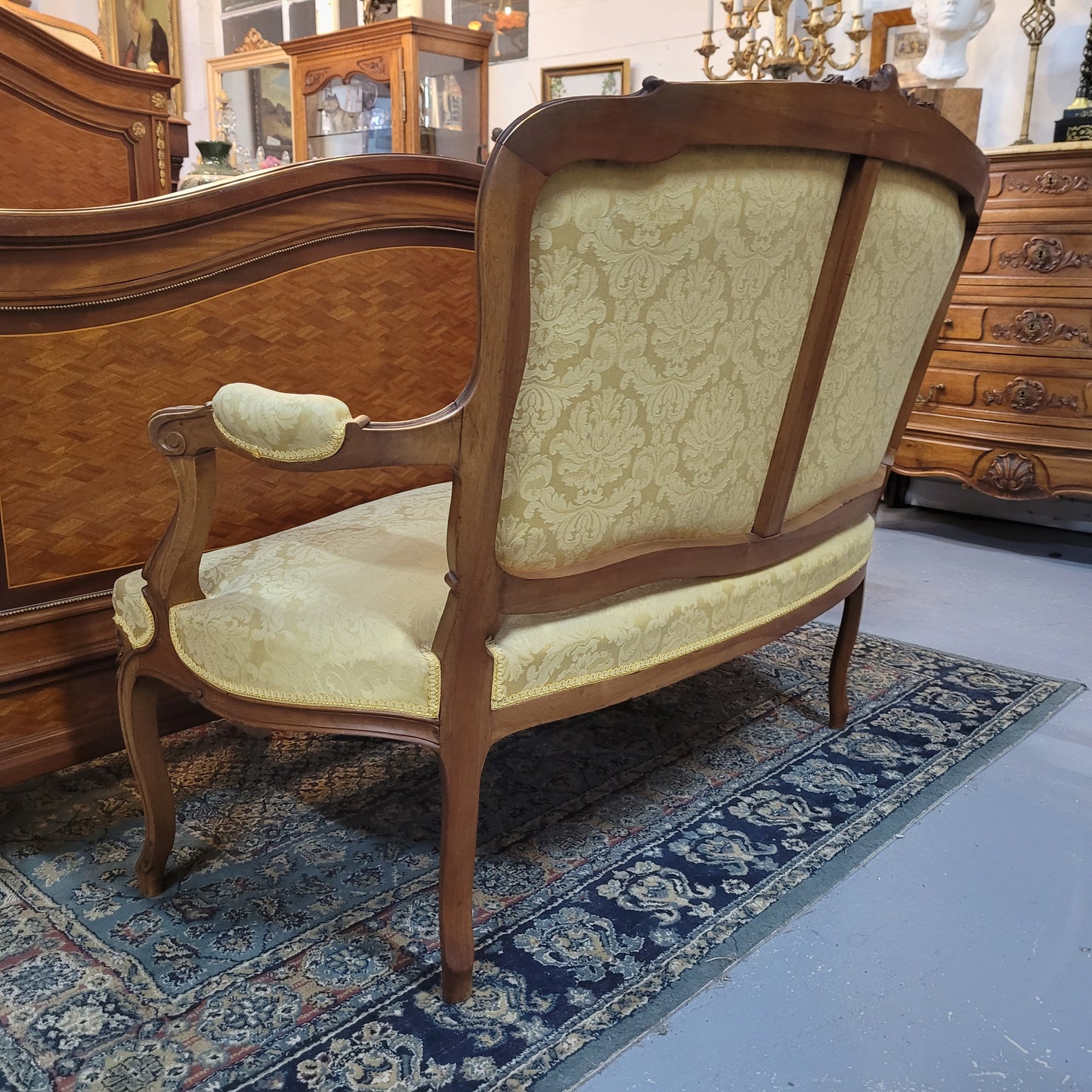 Stunning Louis XV style nicely upholstered walnut settee. Upholstery is in very good original condition, please view photos as they form part of the description. 