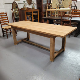 Raw solid Oak French farmhouse dining table that can comfortably sit eight people. It has been sourced from France and is in good original condition.