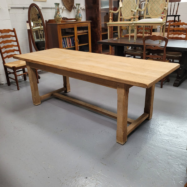 Raw solid Oak French farmhouse dining table that can comfortably sit eight people. It has been sourced from France and is in good original condition.