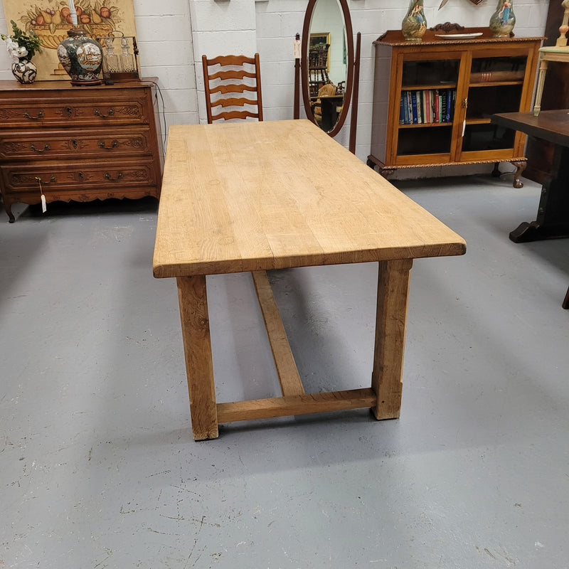 Raw solid Oak French farmhouse dining table that can comfortably sit eight people. It has been sourced from France and is in good original condition.