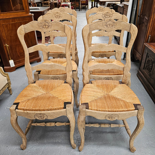 Hard to find set of six striped French Oak rush seat dining chairs. They are in good original detailed condition and have been re-glued. Sourced from France. Please see photos as they form part of the description. 