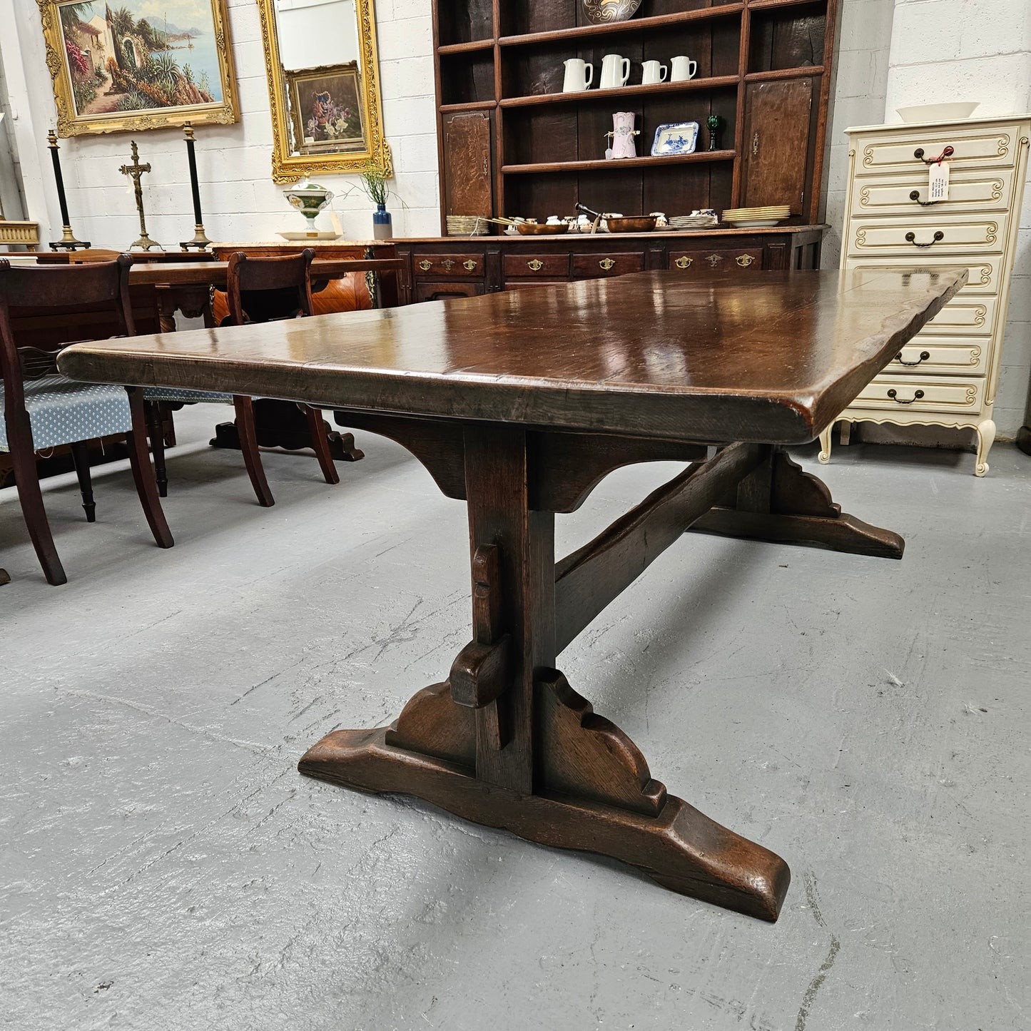 Fabulous dark oak stretcher base dining table. Comfortably sits 8 people. It has been sourced from France and is in good original detailed condition.