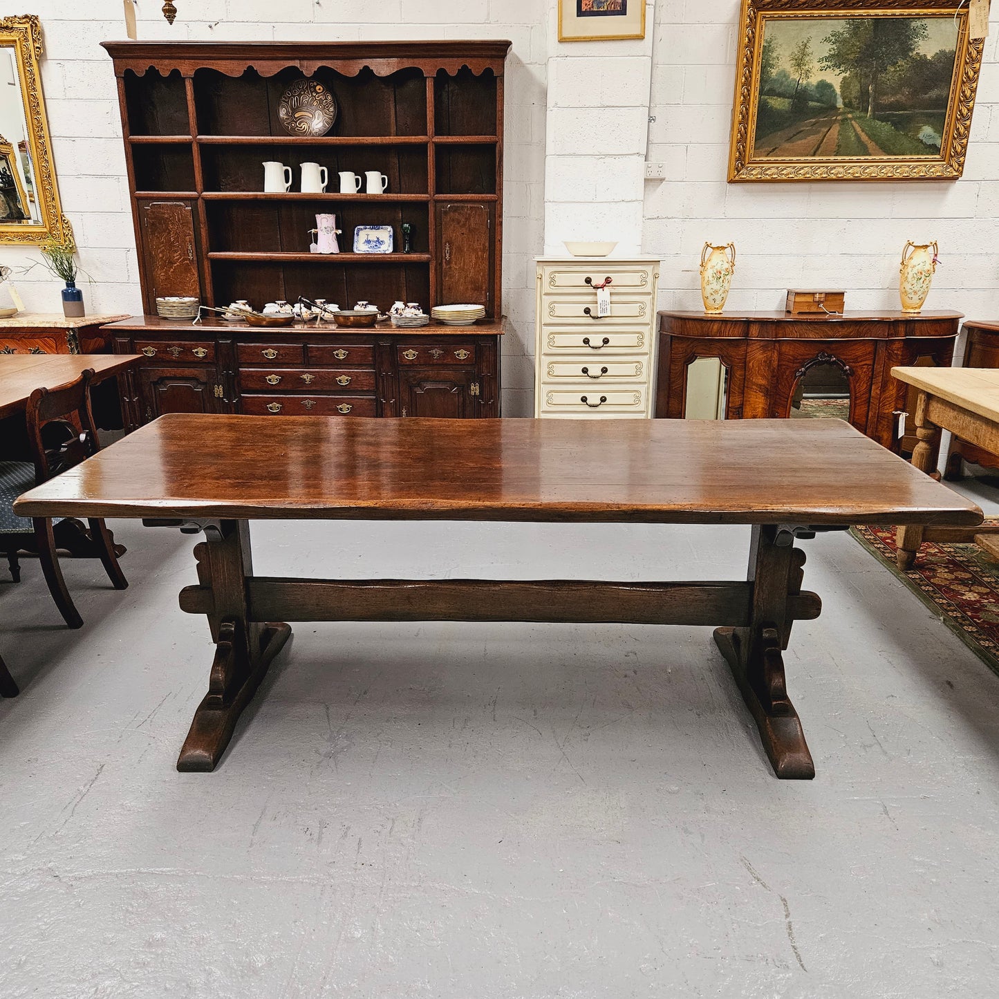 Fabulous dark oak stretcher base dining table. Comfortably sits 8 people. It has been sourced from France and is in good original detailed condition.