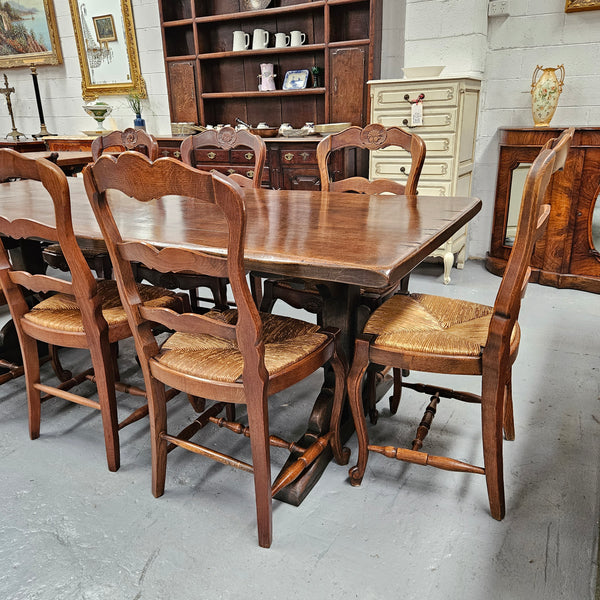 Fabulous dark oak stretcher base dining table. Comfortably sits 8 people. It has been sourced from France and is in good original detailed condition.