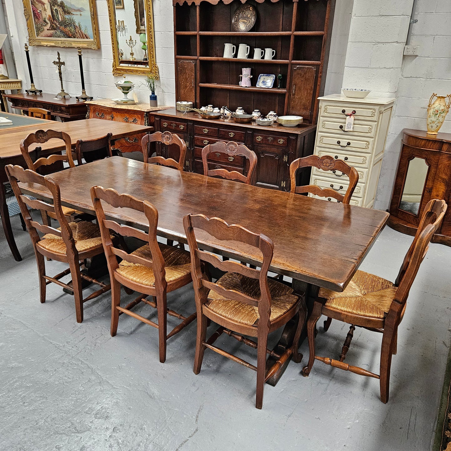 Fabulous dark oak stretcher base dining table. Comfortably sits 8 people. It has been sourced from France and is in good original detailed condition.