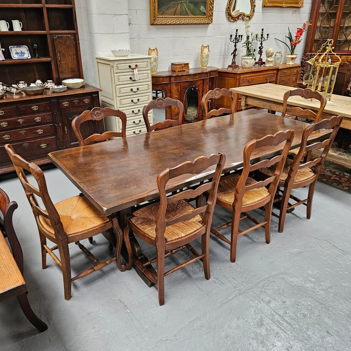 Fabulous dark oak stretcher base dining table. Comfortably sits 8 people. It has been sourced from France and is in good original detailed condition.