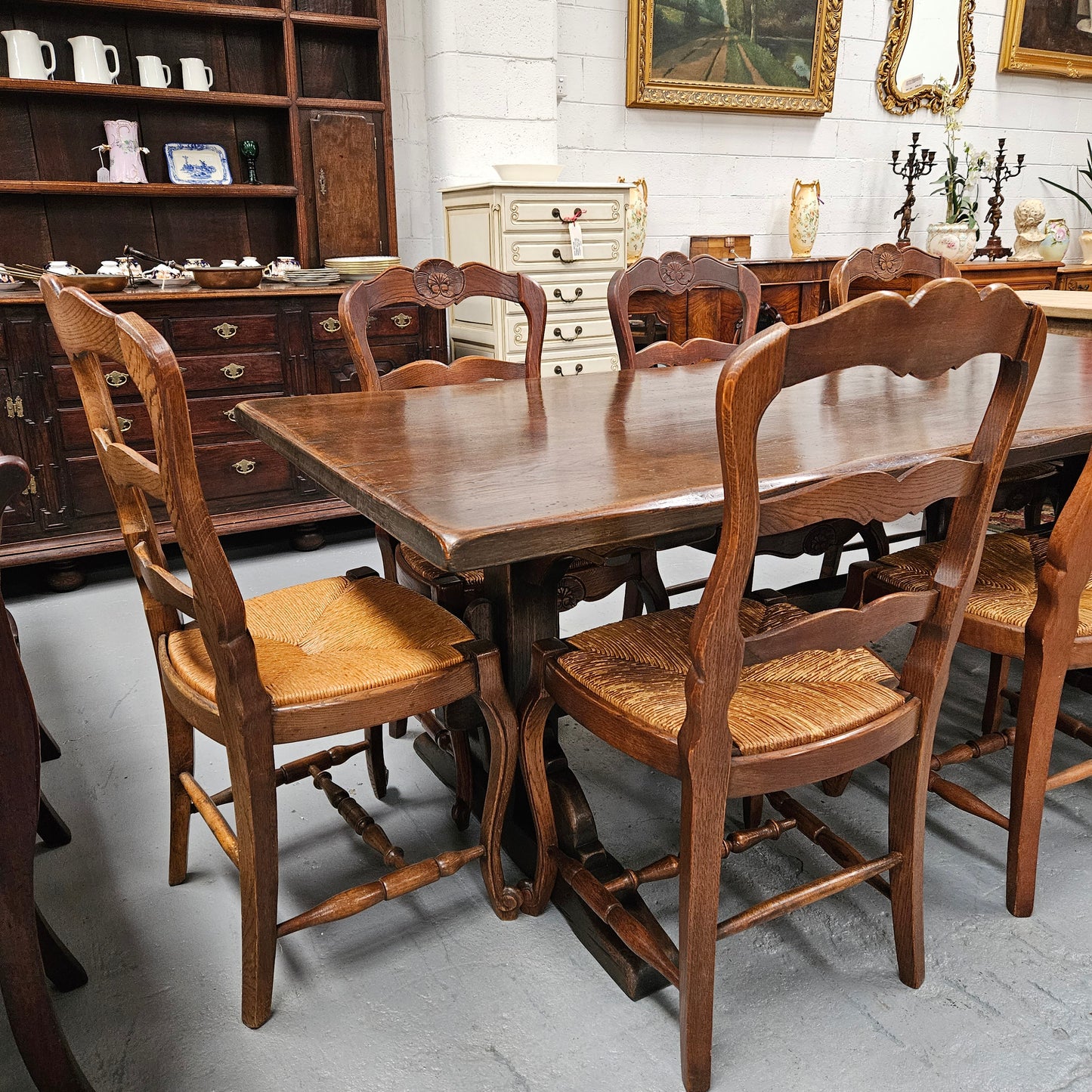 Fabulous dark oak stretcher base dining table. Comfortably sits 8 people. It has been sourced from France and is in good original detailed condition.