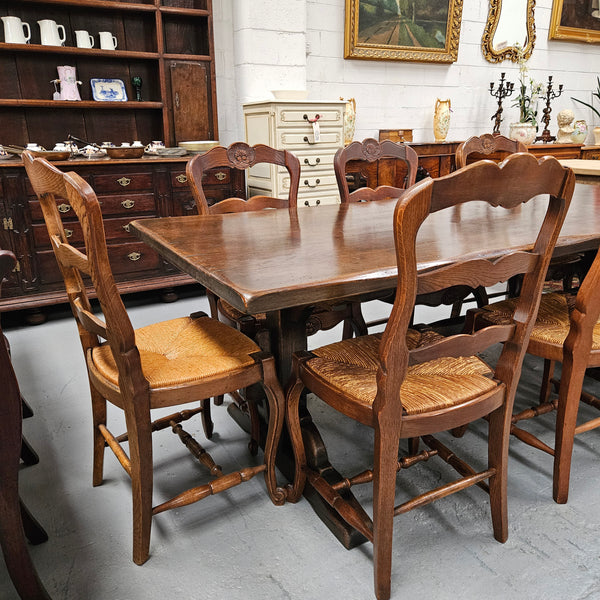 Fabulous dark oak stretcher base dining table. Comfortably sits 8 people. It has been sourced from France and is in good original detailed condition.