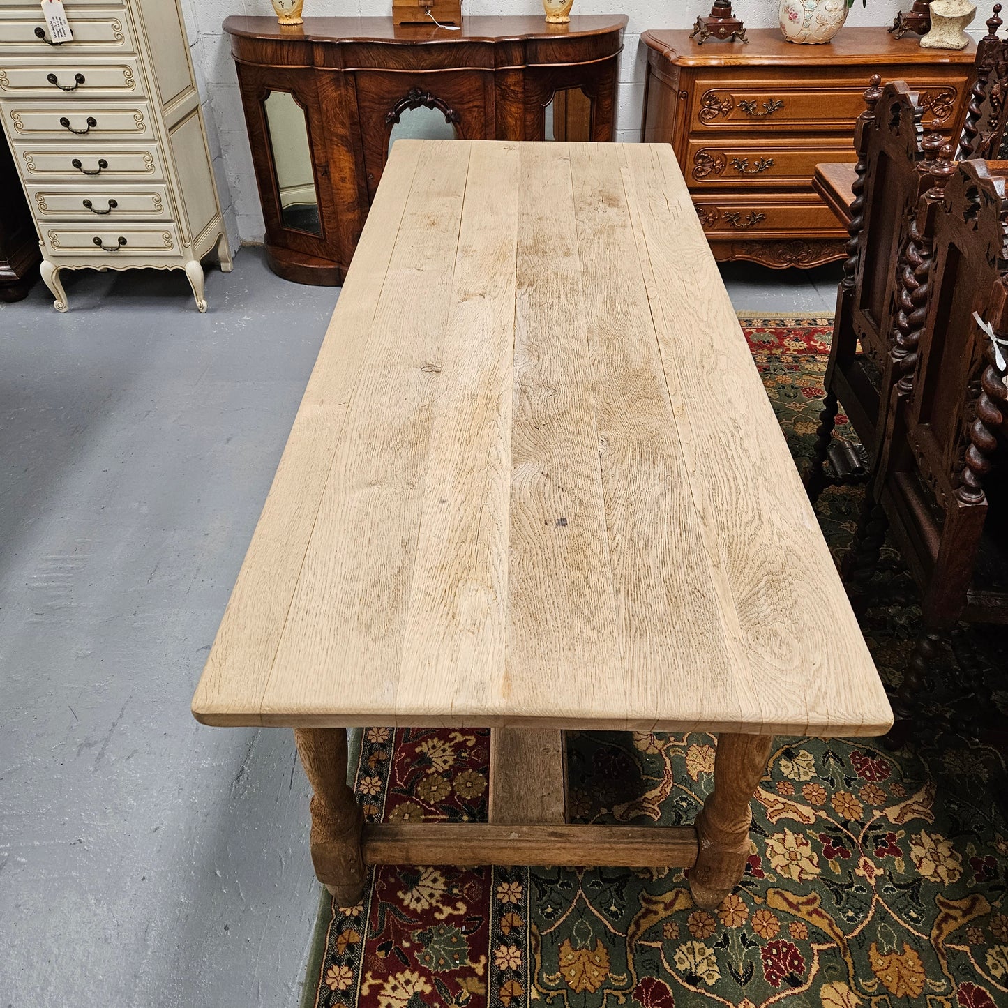 Raw refectory French Oak dining table of pleasing narrow proportions. It has been sourced from France and is in good original condition.