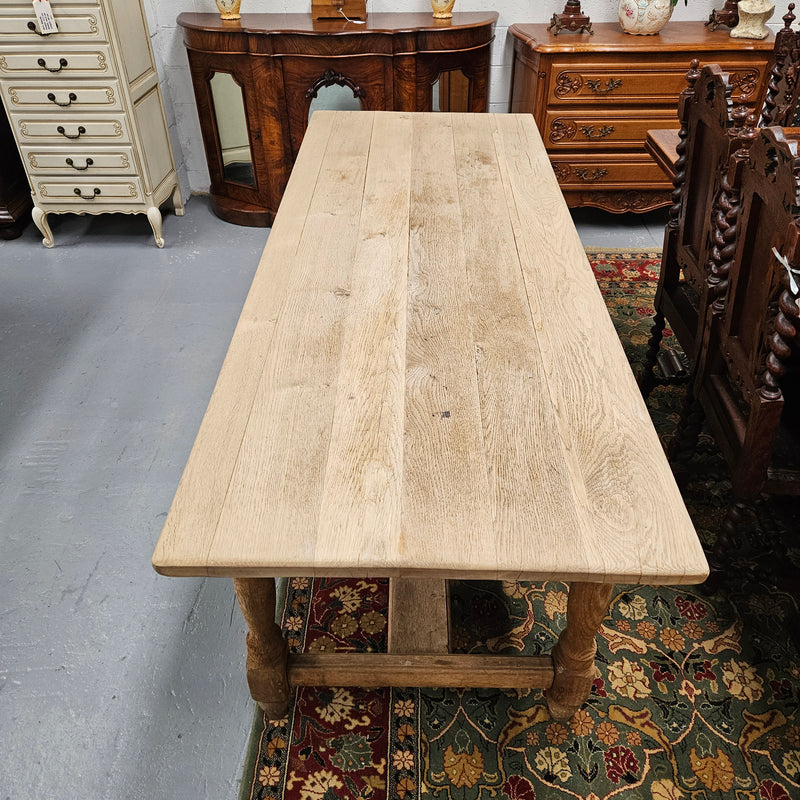 Raw refectory French Oak dining table of pleasing narrow proportions. It has been sourced from France and is in good original condition.