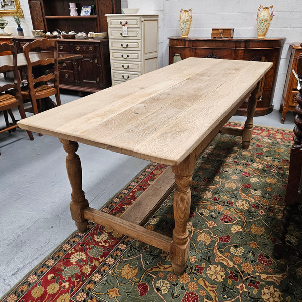 Raw refectory French Oak dining table of pleasing narrow proportions. It has been sourced from France and is in good original condition.