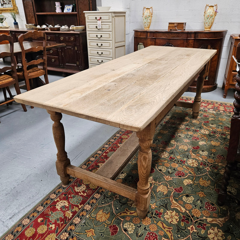 Raw refectory French Oak dining table of pleasing narrow proportions. It has been sourced from France and is in good original condition.