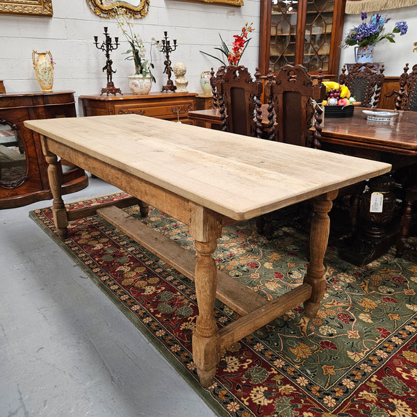 Raw refectory French Oak dining table of pleasing narrow proportions. It has been sourced from France and is in good original condition.